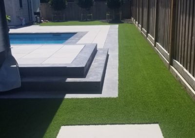 artificial grass beside a pool